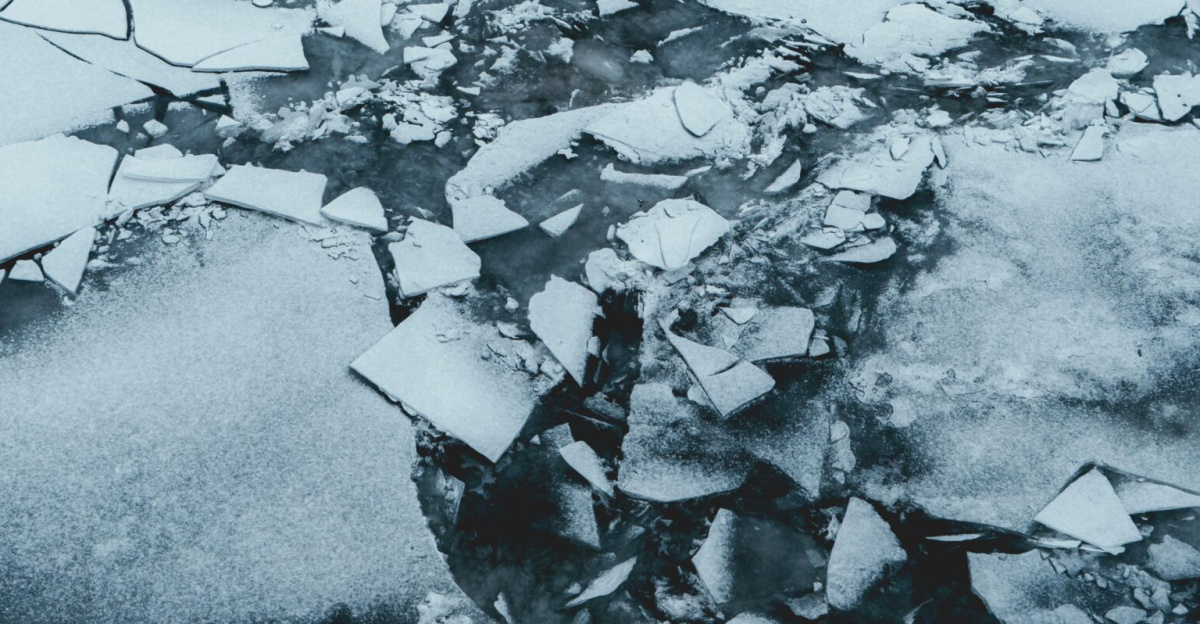 Abstract image of shattered ice pieces floating on a cold winter lake.