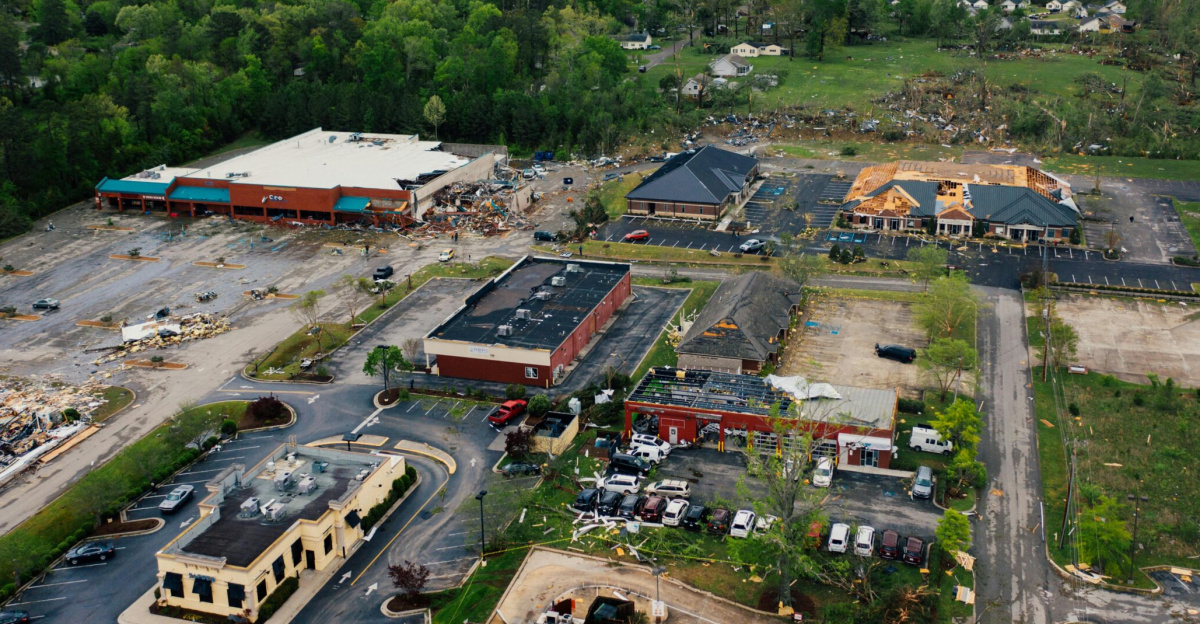 Aerial view showcasing tornado aftermath in Chattanooga, highlighting extensive building damage.