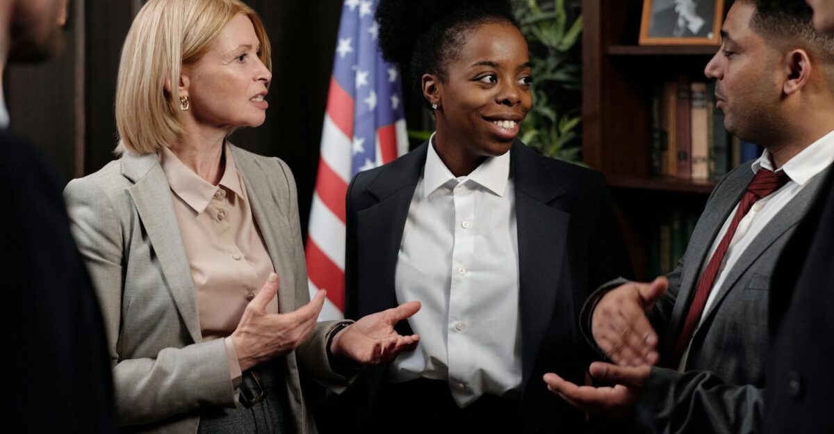 Colleagues in a professional meeting discussing strategies indoors