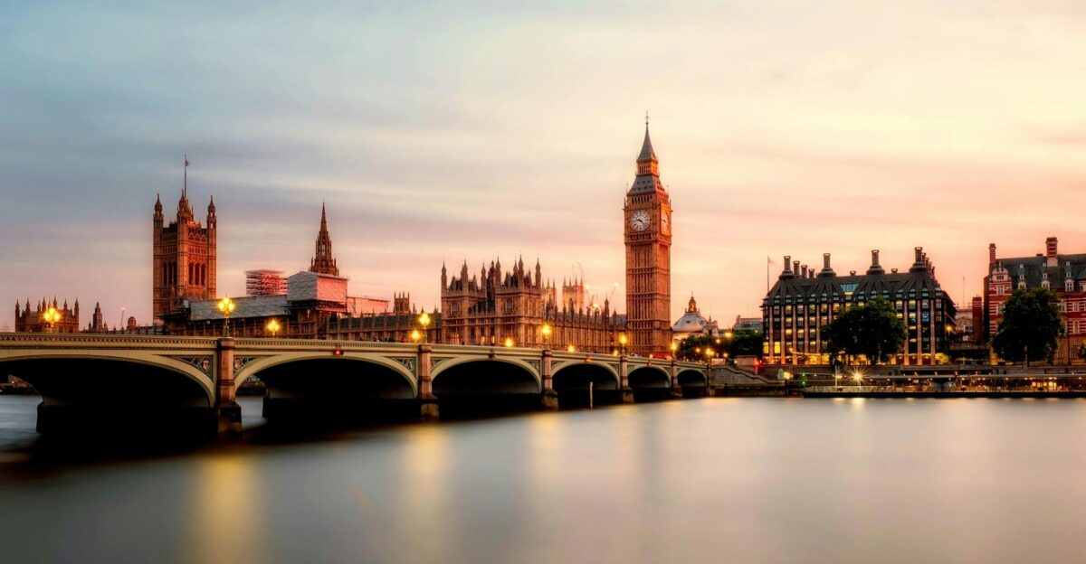 Scenic view of Big Ben and Westminster Bridge over the Thames River at sunset in London UK
