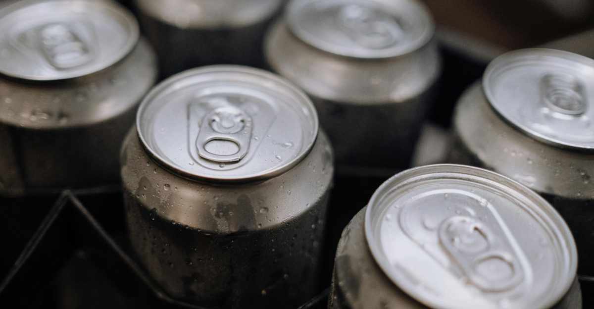 Detailed view of aluminum cans with condensation, perfect for industrial and brewery themes.