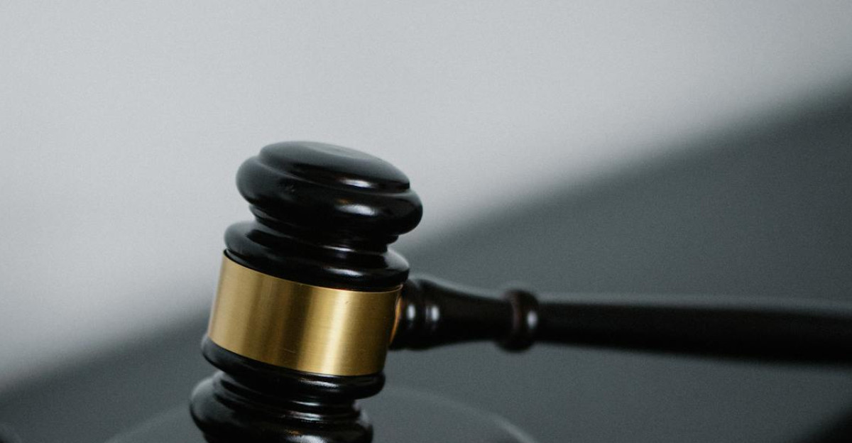 Close-up of a wooden gavel on a desk symbolizing justice and legal authority