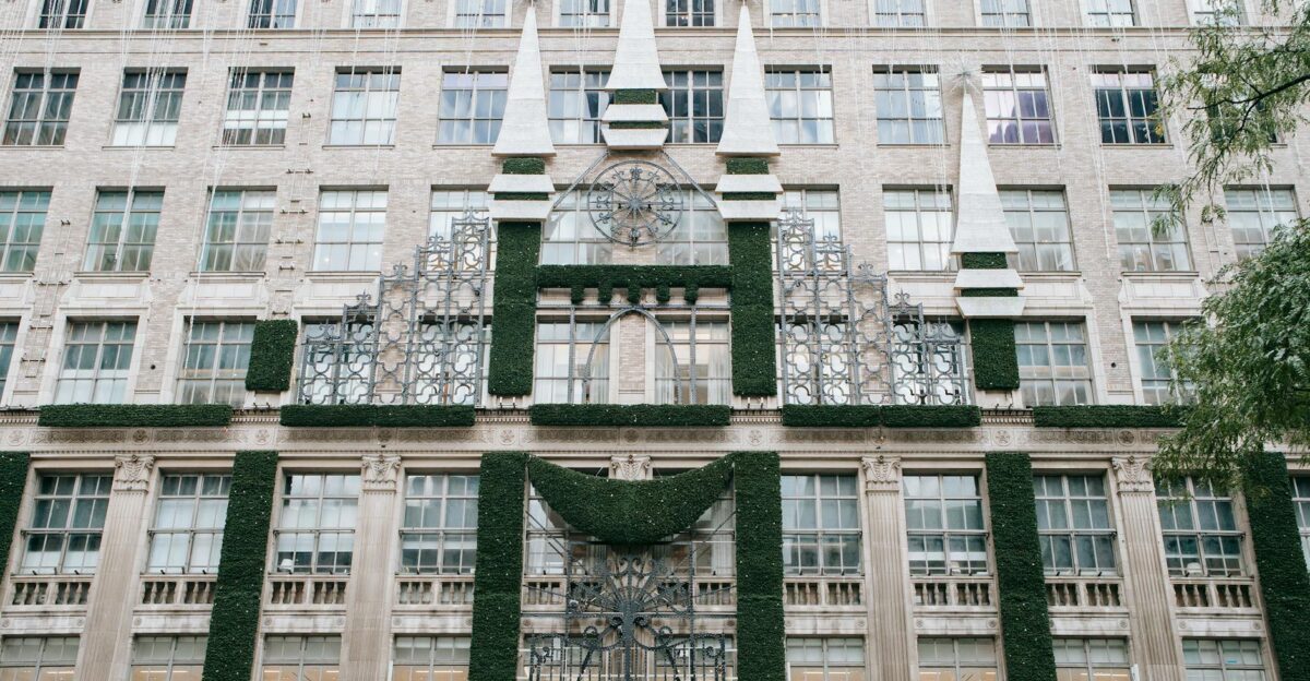 Detailed facade of a multi-story building with greenery and architectural elements in New York City