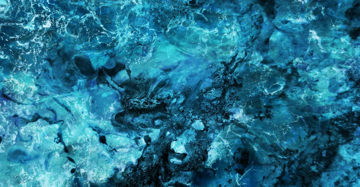 Vivid abstract blue texture resembling ocean waves or marble pattern