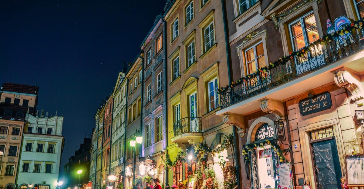 Charming night scene of Warsaw s historic Old Town filled with colorful buildings and lively streets