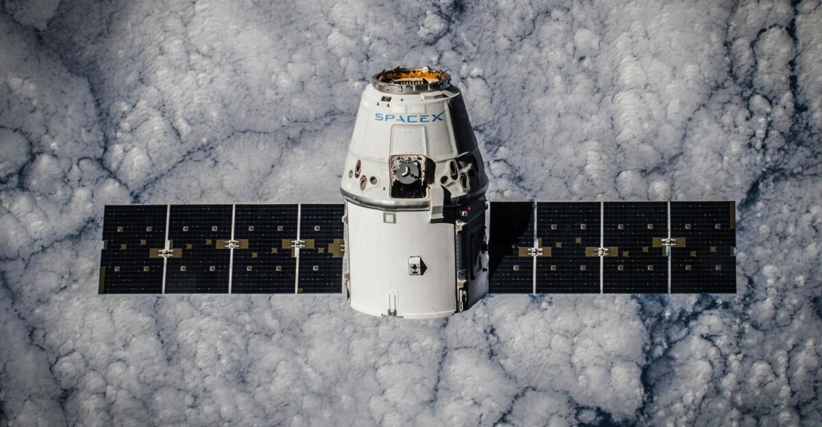 SpaceX Dragon spacecraft in orbit highlighting advanced space technology with cloud backdrop