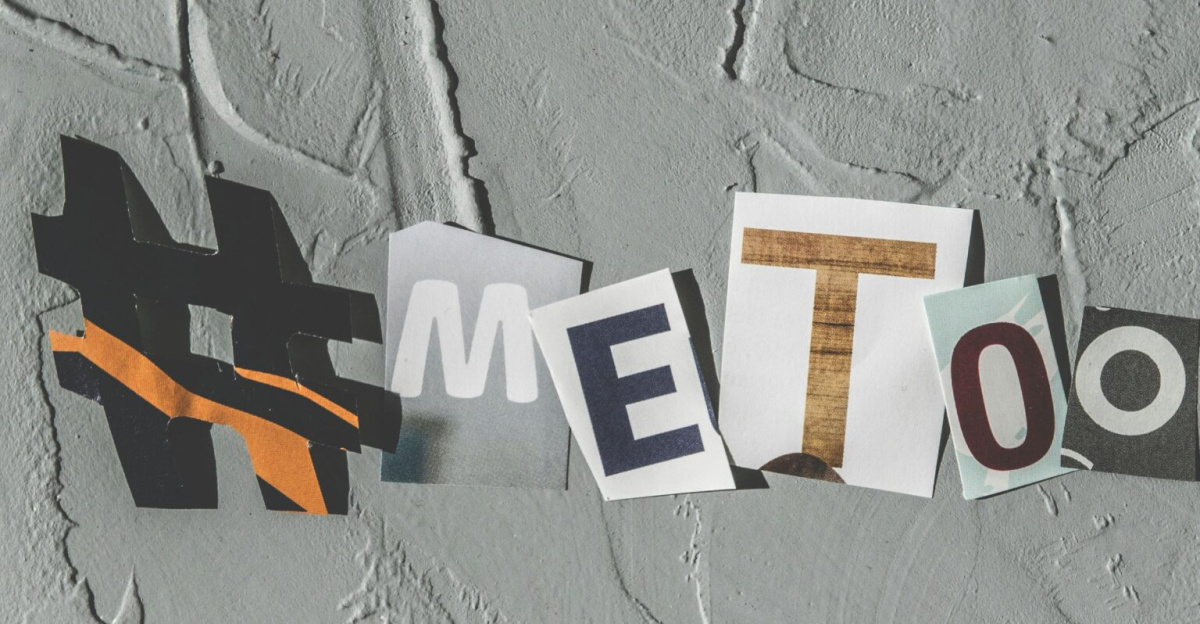 Text art 'MeToo' on concrete background highlighting social movement themes.