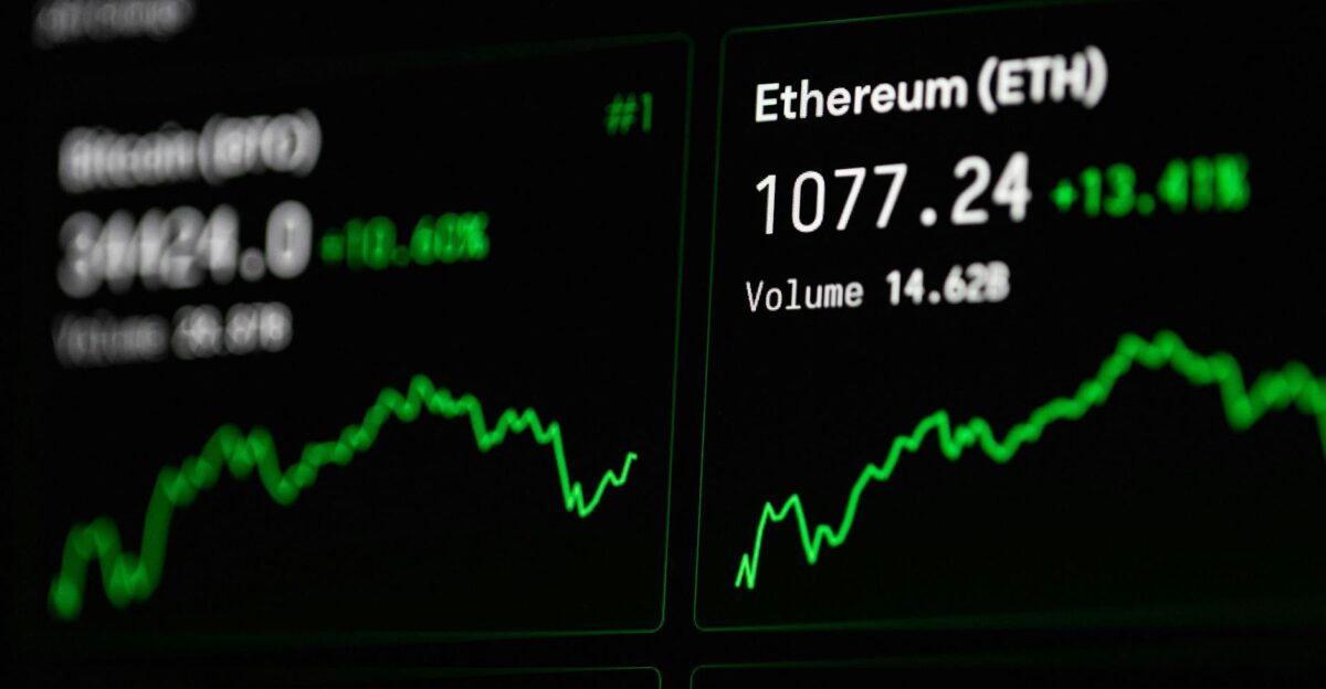 Close-up of cryptocurrency market data with Ethereum and Bitcoin prices on screen