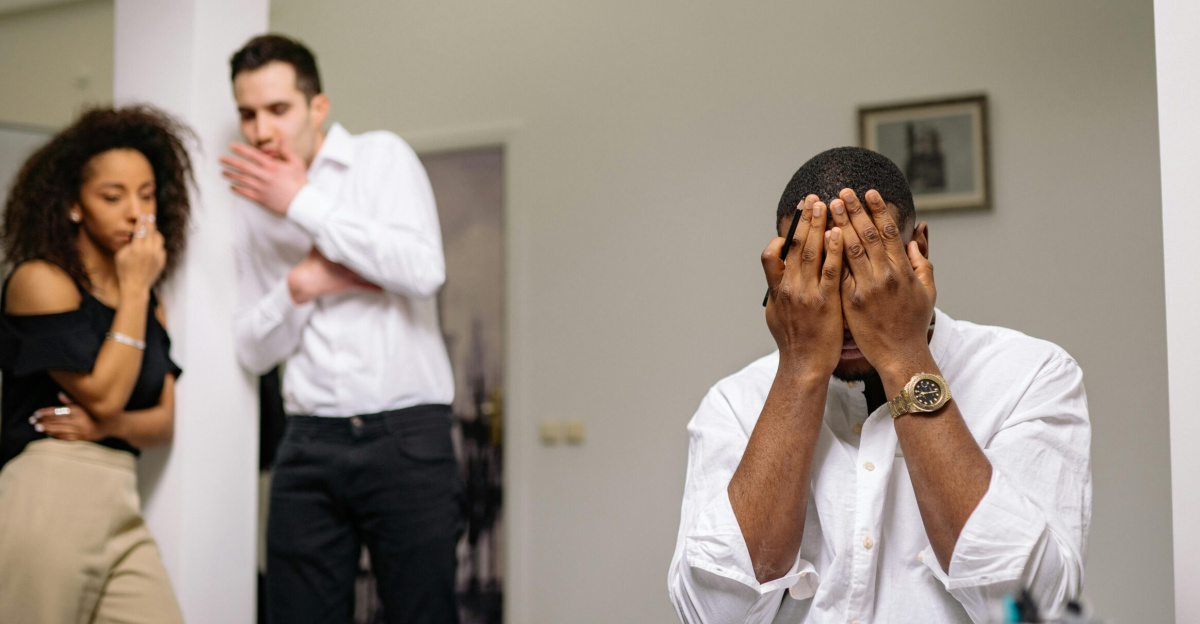 Diverse coworkers in tense office conflict scene, highlighting workplace issues.