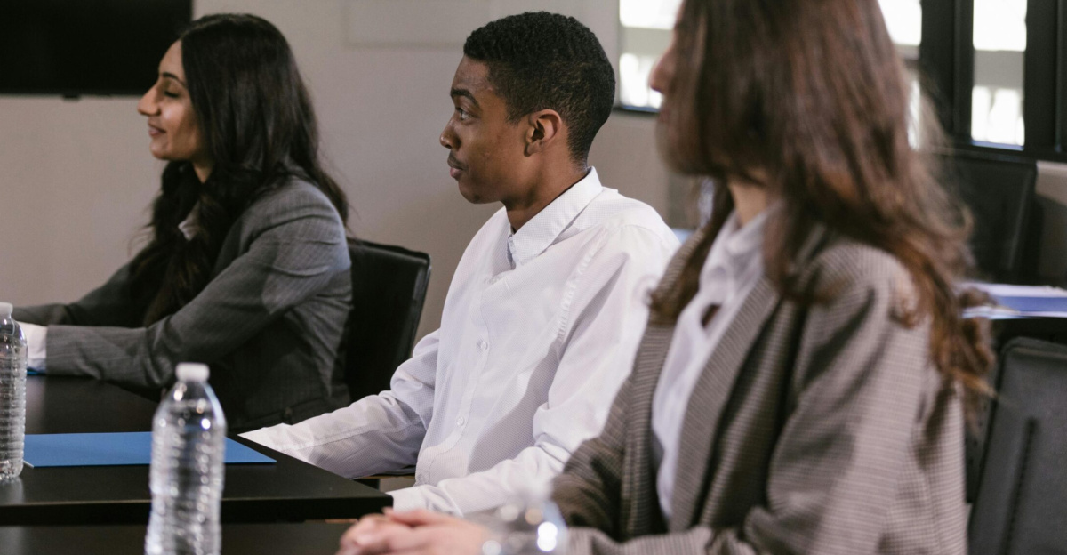 Diverse professionals attending a meeting in a modern conference room.