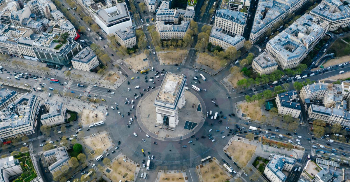 Breathtaking aerial image of Arc de Triomphe nestled within Paris s vibrant cityscape