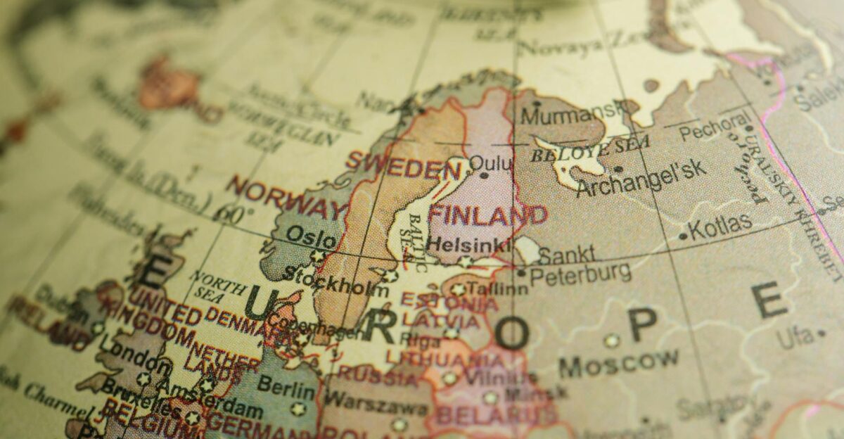 Detailed close-up image of a globe focusing on Northern Europe featuring country labels and borders