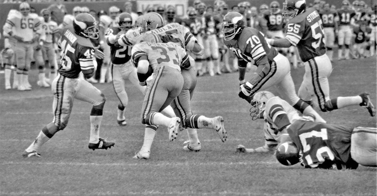 A vintage capture of athletes competing in a high-energy football game