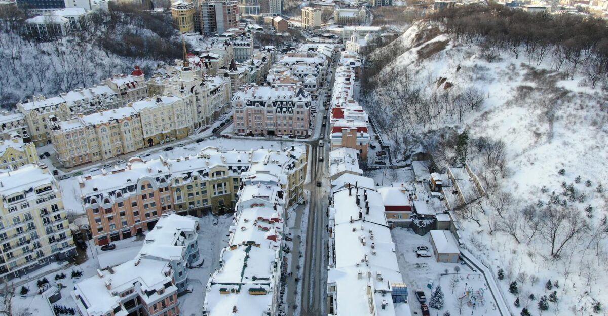 Snow-covered buildings and streets in Kyiv Ukraine captured from above during winter