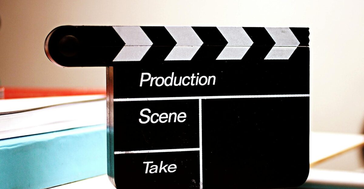 Close-up of a film clapperboard on a desk ideal for media and production themes