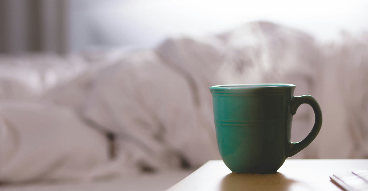 green ceramic mug on wooden desk