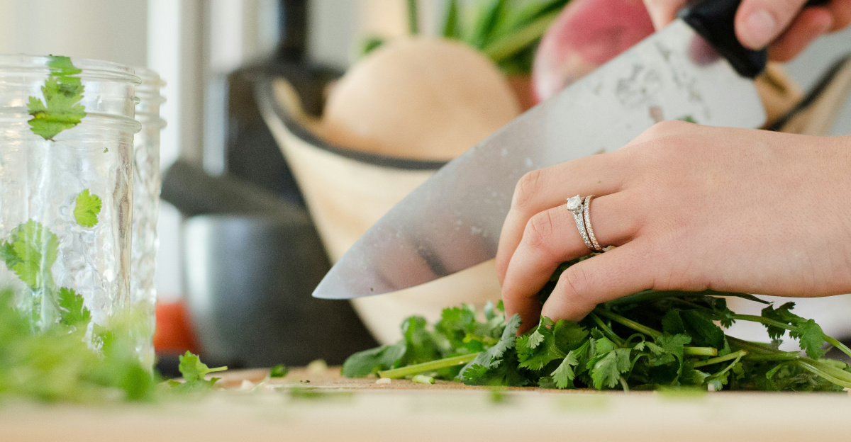 person cutting vegetables with knife