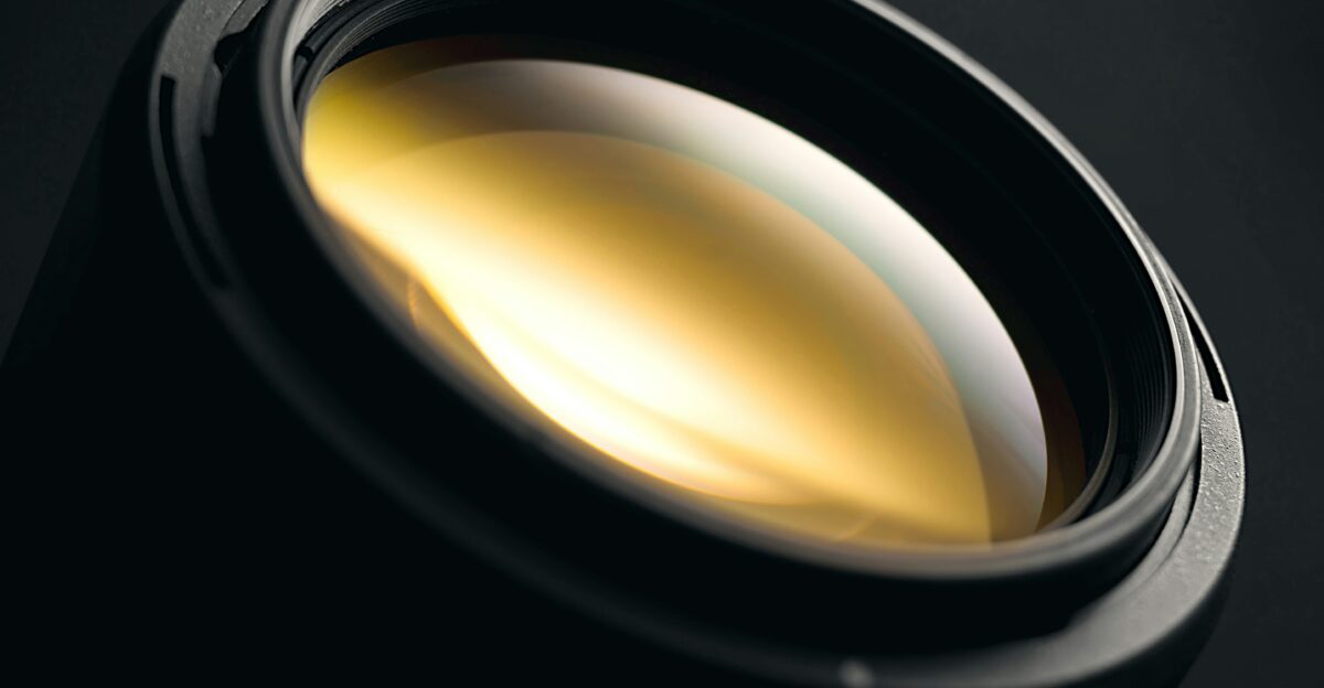 a close up of a camera lens on a black background