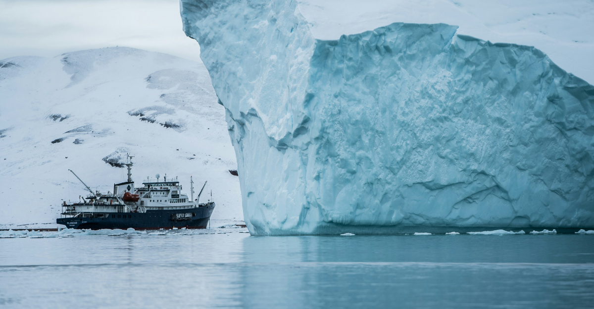 boat beside iceberg
