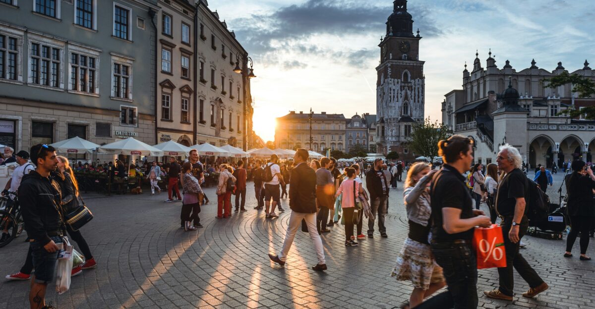 people walking on street near concrete buildings