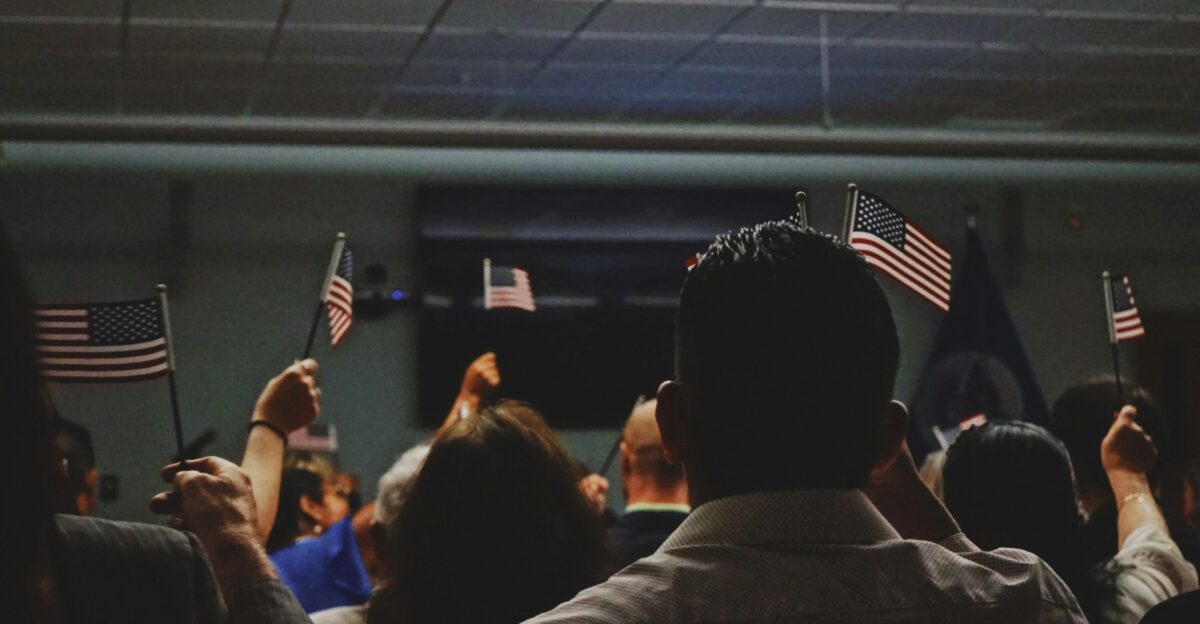 people holding flag of U S A miniature