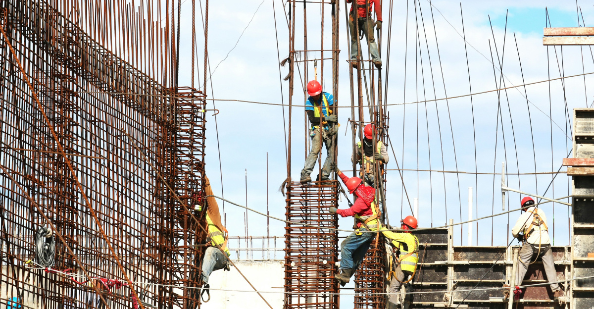 people working on building during daytime