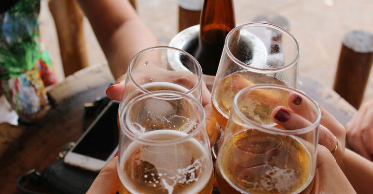 four clear stemless glasses