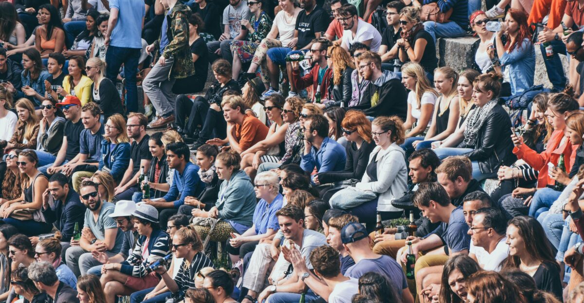 people sitting on stadium