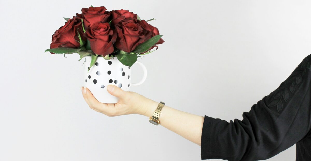 red rose arrangement on mug