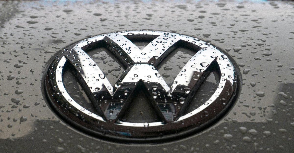 water dew on silver Volkswagen car emblem