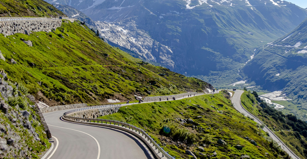 gray road and green grass