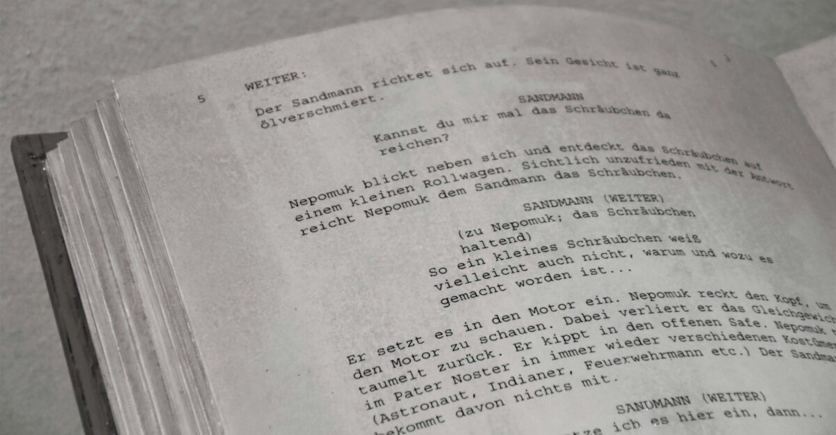 a close up of an open book with writing on it