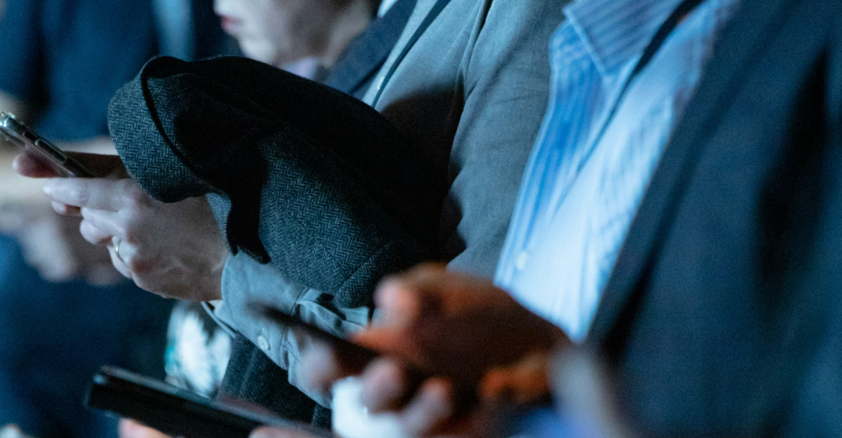 people using phone while standing