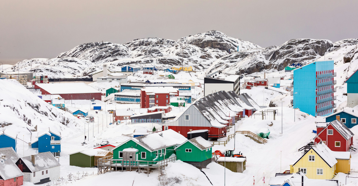 town on hill covered with snow