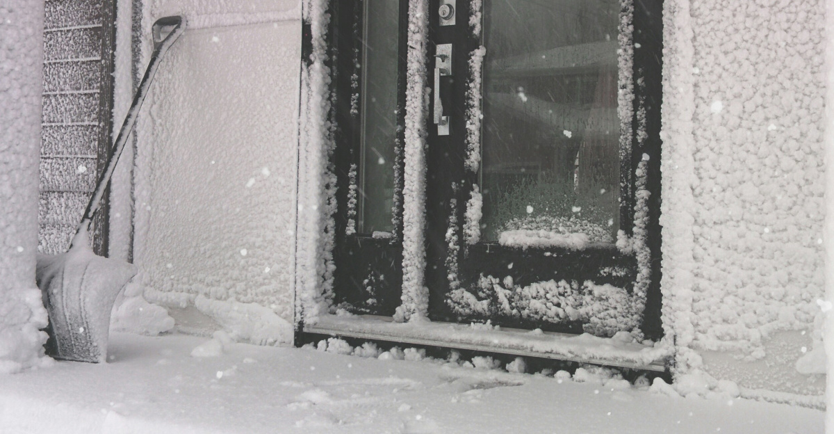 a snow covered front door of a building