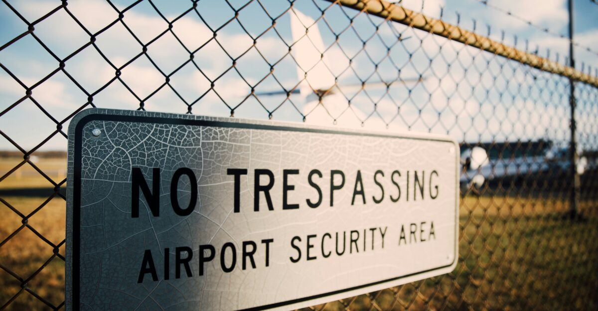 No Trespassing signage on fence