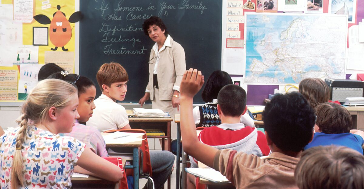 woman standing in front of children