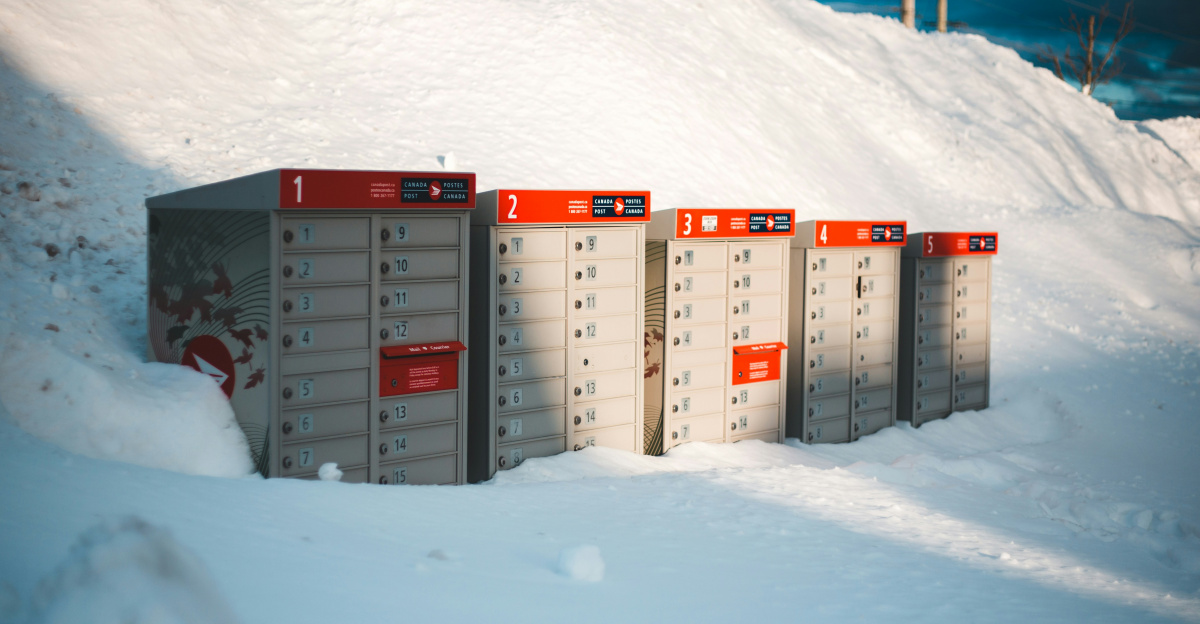 white and red storage boxes on snow covered ground