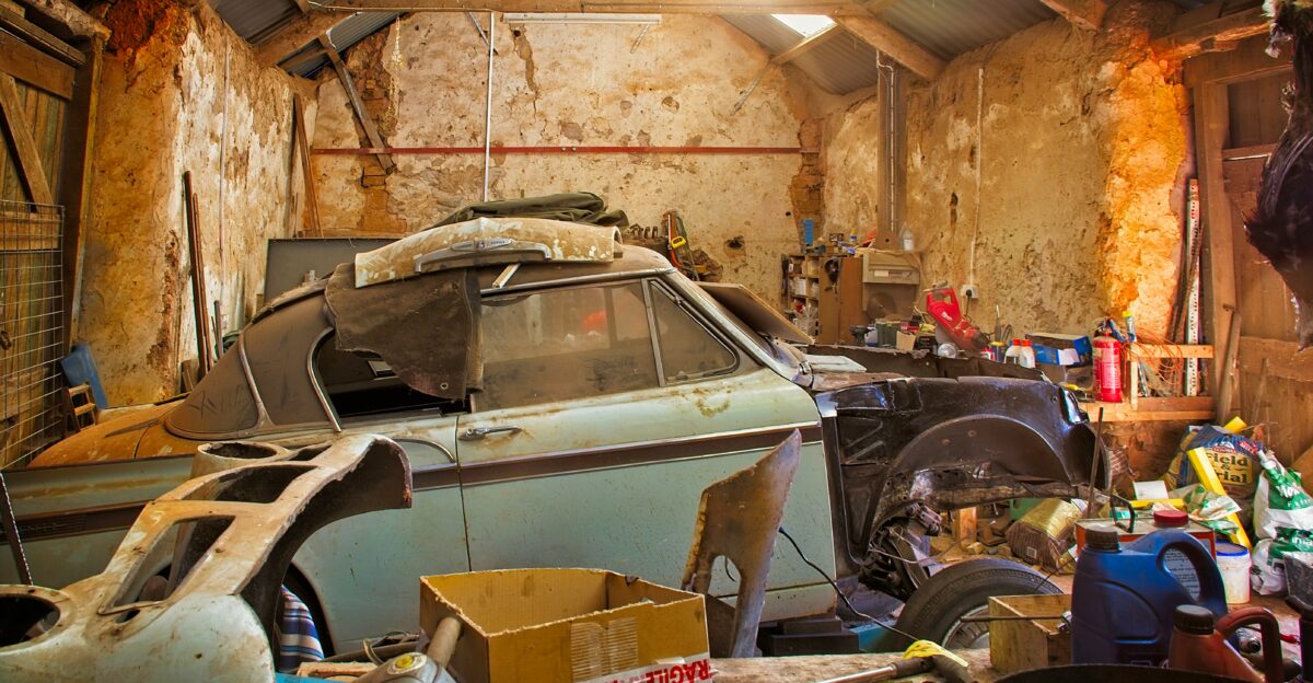 brown cardboard box on gray car