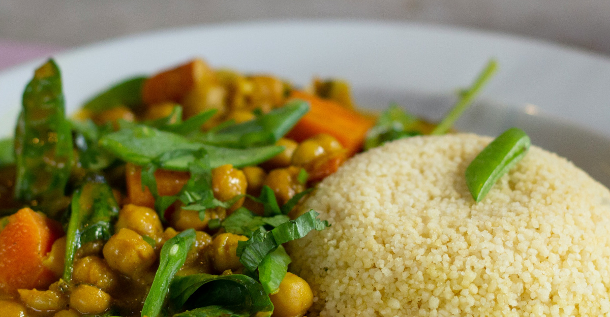 rice with green leaf vegetable on white ceramic plate