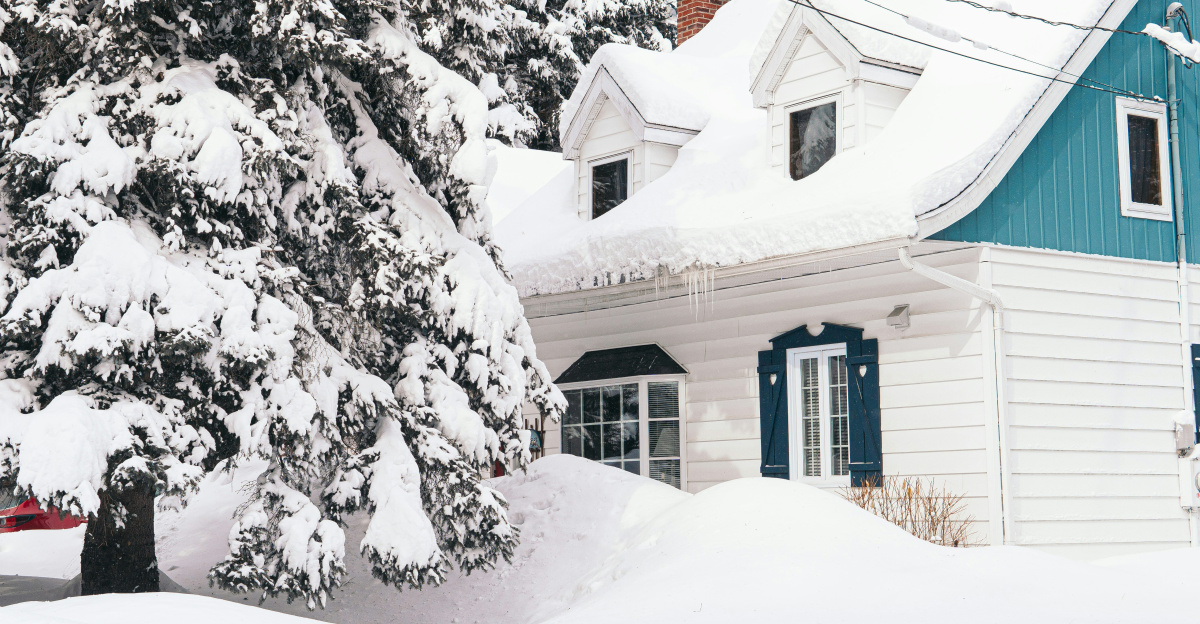 brown house covered with snow near trees during daytime
