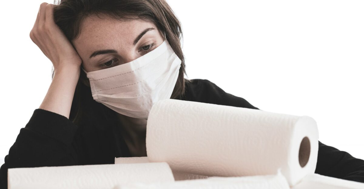 woman covering her face with white tissue paper