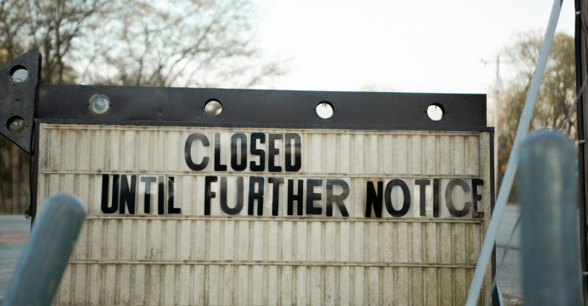 white and black wooden signage