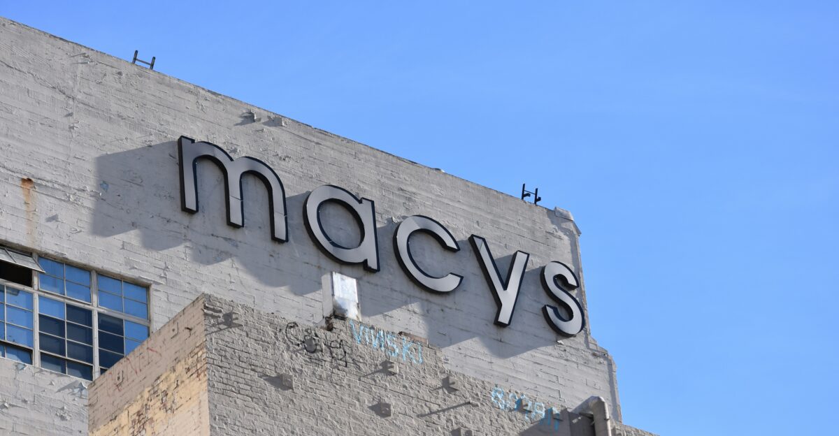low angle photo of gray concrete building under blue sky during daytime
