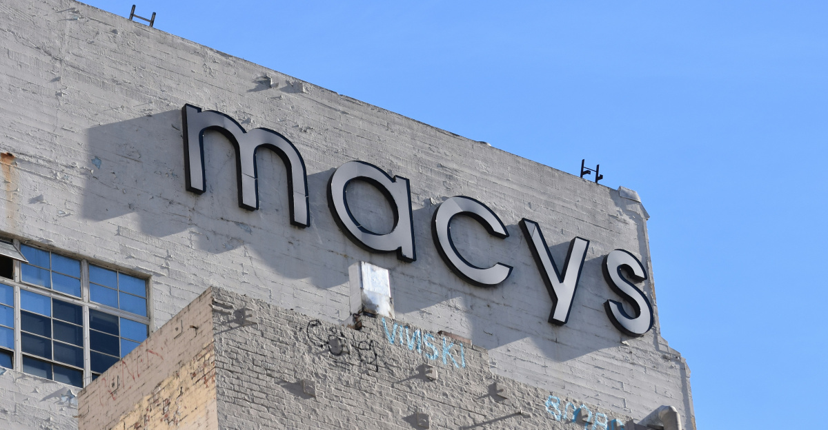 low angle photo of gray concrete building under blue sky during daytime