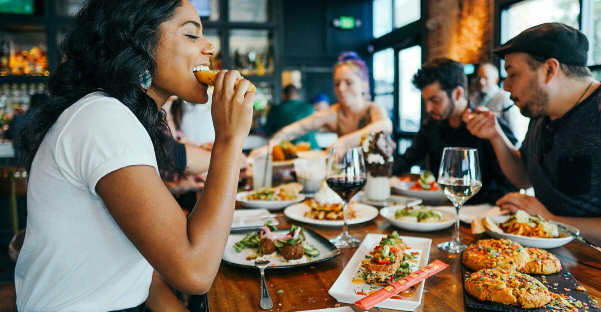 woman in white shirt eating
