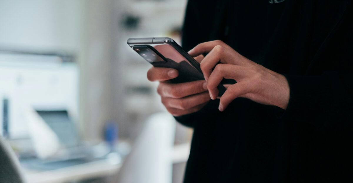 person holding black android smartphone
