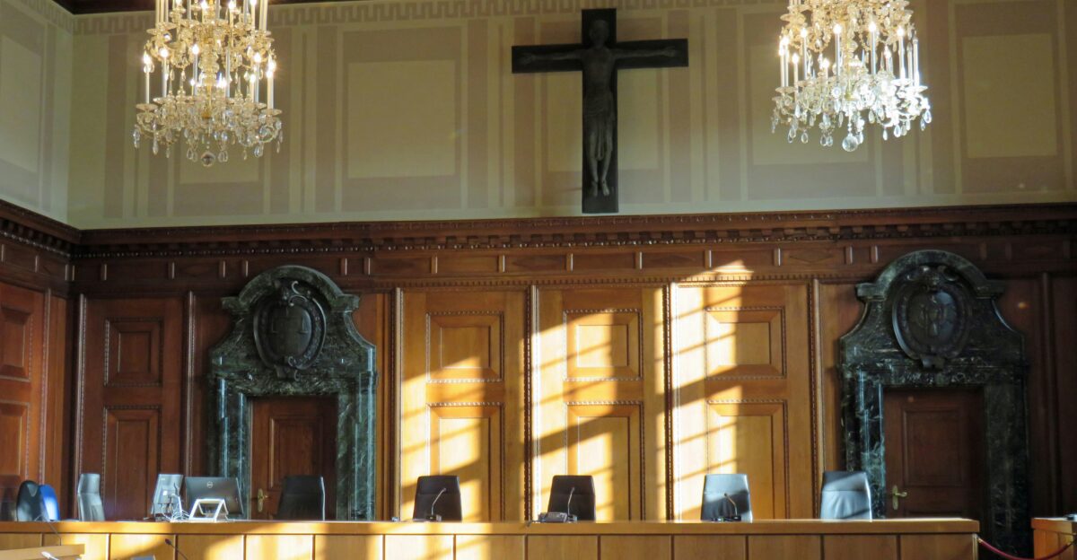 black cross on brown wooden table