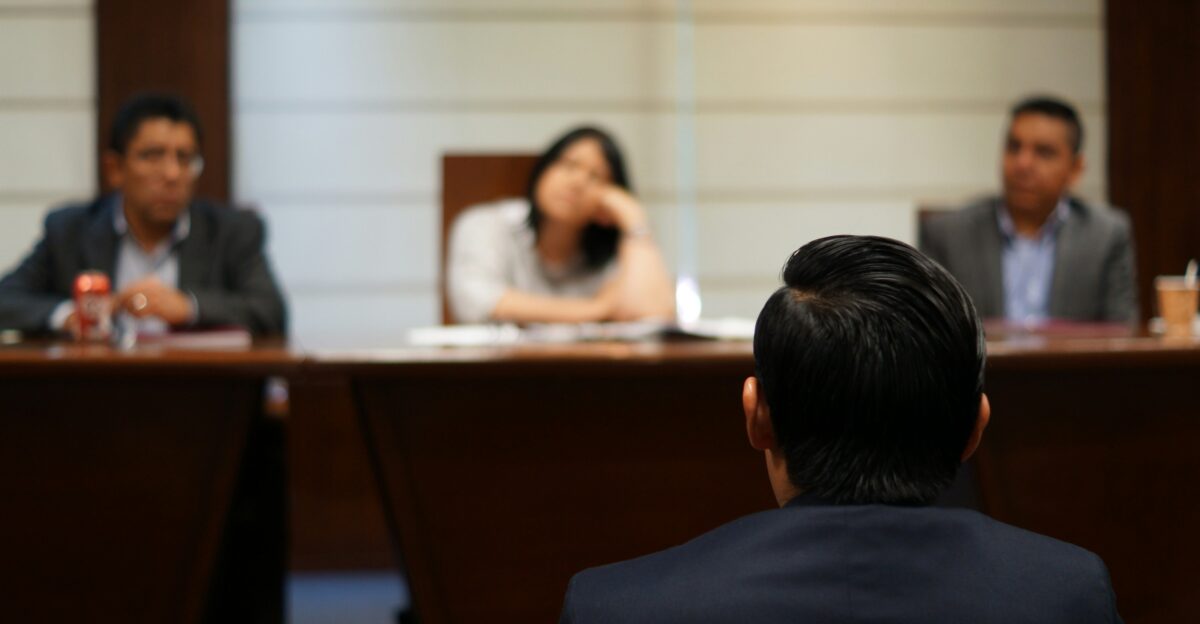 man in black shirt sitting beside woman in white shirt