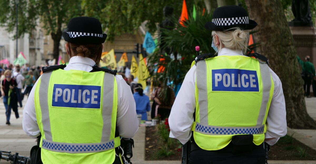 man in white and green adidas jersey shirt and black hat
